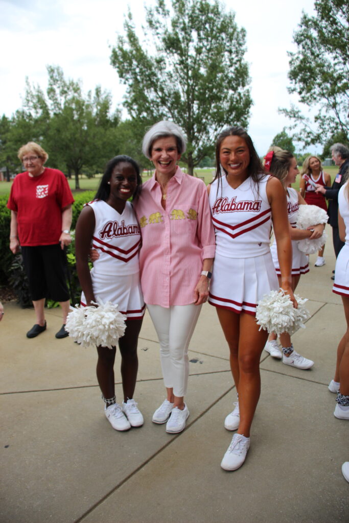 Female resident with 2 Alabama cheerleaders