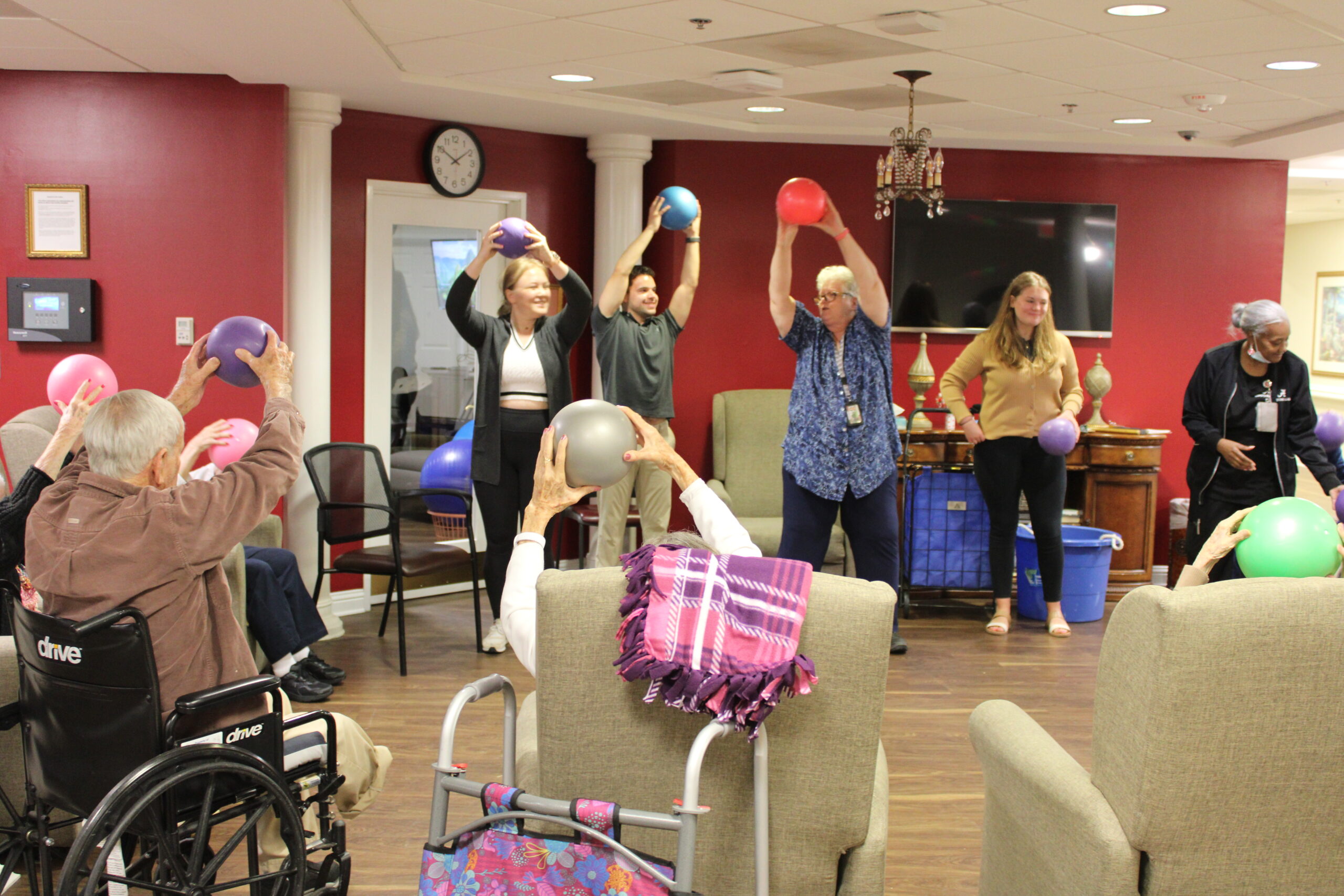 UA Students join the Resident Services Director playing games with Traditions Way residents